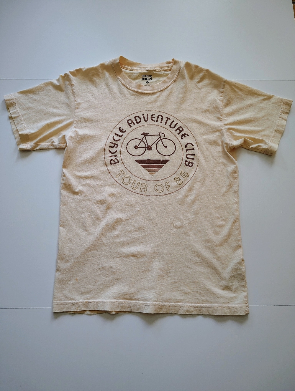 Anthropologie/ Back When/ Bicycle Adventure Club 'Tour of 84' Graphic Tee- Cream
